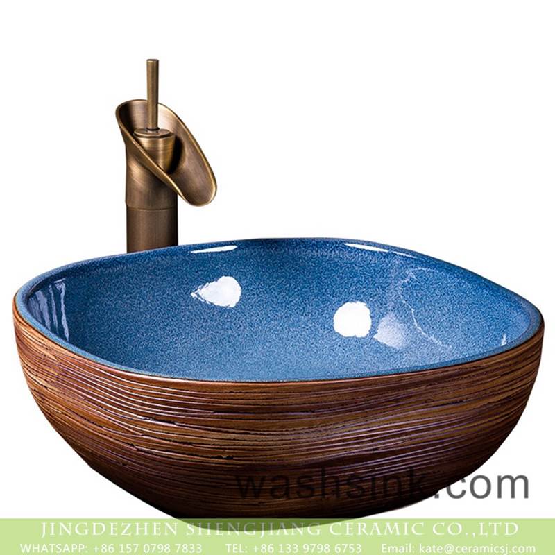 Factory wholesale price art ceramic dark blue wall and the wood color surface vanity basin