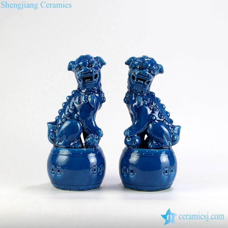 pair of ceramic lion figurines