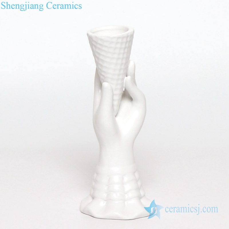 hand holds ice cream cone pottery vase