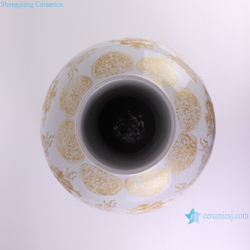 top view of white background golden color dragon pattern ceramic globular decorative vase
