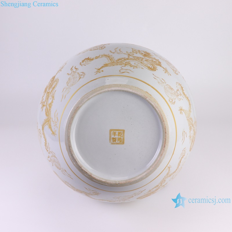 bottom view of white background golden color dragon pattern ceramic globular decorative vase